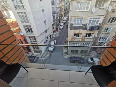 a view of a city street from a balcony at CTS Taksim Elysium Residence Dublex D-84 in Istanbul