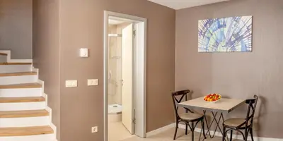 a small dining room with a table and chairs at Elm Suite Hotel in Istanbul