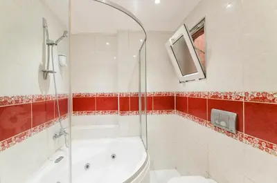a bathroom with a shower and a tub and a sink at TAXİM ELEGANCE SUİTES in Istanbul