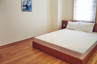 a bedroom with a large bed with white sheets at TAXİM ELEGANCE SUİTES in Istanbul