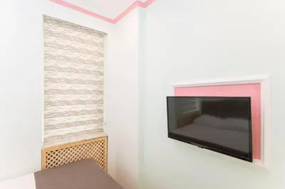 a room with a flat screen tv on a wall at TAXİM ELEGANCE SUİTES in Istanbul