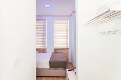 a bedroom with a bed and a window at TAXİM ELEGANCE SUİTES in Istanbul