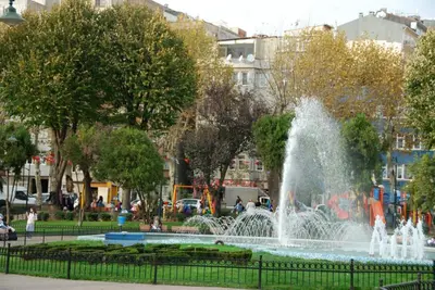 a fountain in a park in a city at Enderun by Otantik Suites in Istanbul