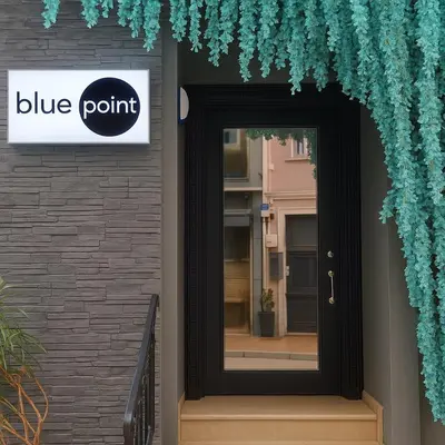a black door with a blue point sign on a building at Blue Point Hotel in Istanbul