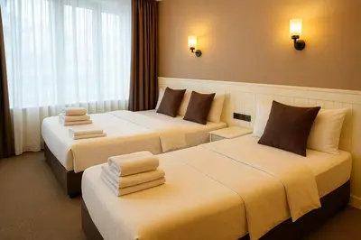 a hotel room with two beds with towels on them at Blue Point Hotel in Istanbul