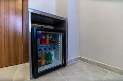 a refrigerator filled with drinks in a room at Gul Otel in Istanbul