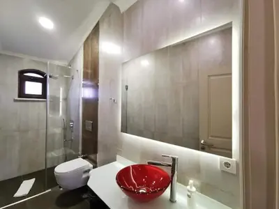 a bathroom with a red sink and a toilet at Ottobalat in Istanbul