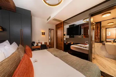 a hotel room with a bed and a bathroom at Levni Plus Hotel in Istanbul