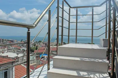 a balcony with stairs and a view of a city at Good Night Hotel Istanbul in Istanbul