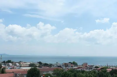 a view of a city with the ocean in the background at Good Night Hotel Istanbul in Istanbul