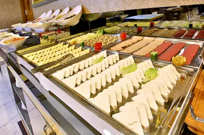 a buffet line of food in a restaurant at The Tango Hotel Taksim in Istanbul