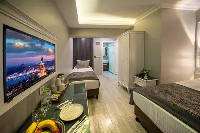 a hotel room with a large picture of a city at Beyazit Palace Hotel in Istanbul
