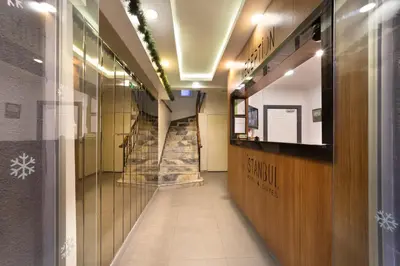 a hallway with a staircase in a building at İstanbul Hotel & Suites in Istanbul
