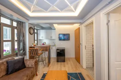 a living room with a couch and a table at Dorne Suite Taksim Hotel in Istanbul