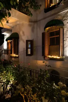 a building with windows with lights on them at No2 Hotel By Şükrü in Adalar