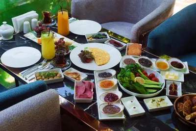 a table with plates of food on top of it at No2 Hotel By Şükrü in Adalar