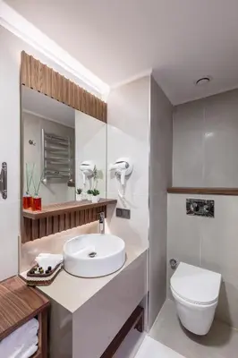 a bathroom with a white sink and a toilet at Sherry Suites Karaköy in Istanbul