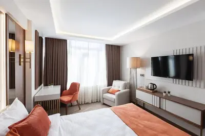 a hotel room with a bed and a television at Sherry Suites Karaköy in Istanbul