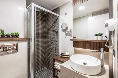 a bathroom with a sink and a shower at Sherry Suites Karaköy in Istanbul