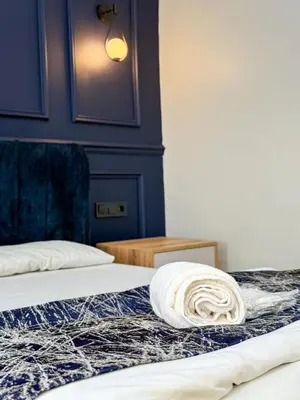 a close up of two beds in a room at The Reina Hotel in Istanbul