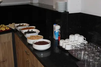 a counter with several bowls of food on a table at The Reina Hotel in Istanbul