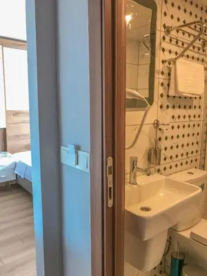 a bathroom with a sink and a mirror at Sultanahmet Nu Hotel in Istanbul