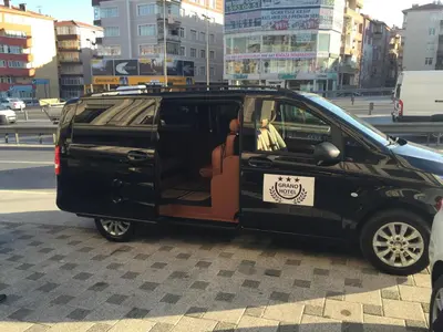 a black van with a door open on a city street at Grand Hotel Avcılar in Istanbul