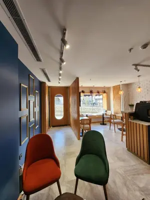 a lobby with two chairs and a table at Taksim Landhouse Hotel in Istanbul