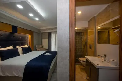 a hotel room with a bed and a bathroom at Tamara Residence Hotel İstanbul in Istanbul
