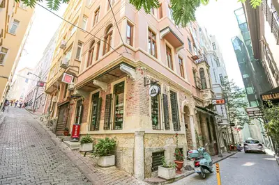 a building with a scooter parked in front of it at No 8 Galata in Istanbul
