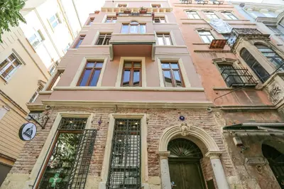 a building with a clock on the side of it at No 8 Galata in Istanbul