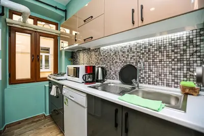 a kitchen with a sink and a microwave at No 8 Galata in Istanbul