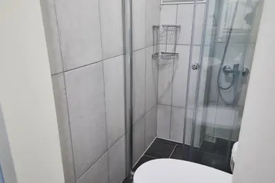 a bathroom with a shower with a toilet at No 8 Galata in Istanbul