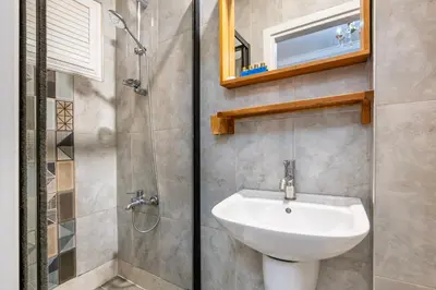 a bathroom with a sink and a shower at Taksim Dora Hotel in Istanbul
