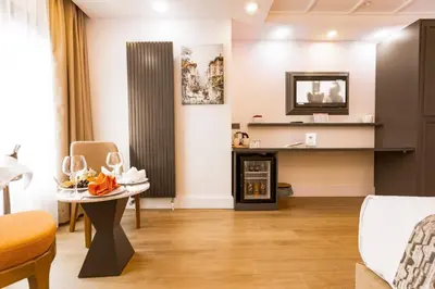 a living room with a table and a couch at Antusa Design Hotel & Spa in Istanbul