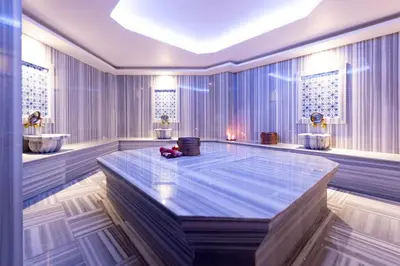 a large room with a table and two sinks at Antusa Design Hotel & Spa in Istanbul