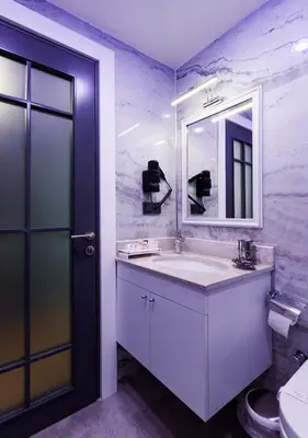 a bathroom with a sink and a mirror and a toilet at Antusa Design Hotel & Spa in Istanbul