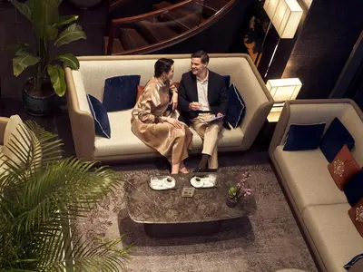 a man and a woman sitting on a couch at Lasagrada Hotel Istanbul in Istanbul