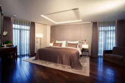 a bedroom with a large bed and a couch at Lasagrada Hotel Istanbul in Istanbul