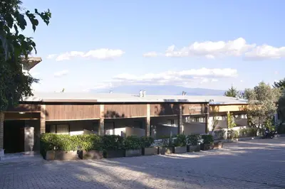a building with a lot of plants in front of it at Heybeli Garden in Bursa