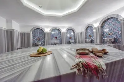 a room with a table with hats and shoes on it at Heybeli Garden in Bursa