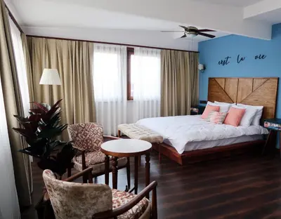 a bedroom with a bed and a table and chairs at Fuego Design Suites in Istanbul