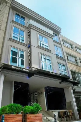 a building with a sign for a hotel at Mayer Hotel Istanbul in Istanbul