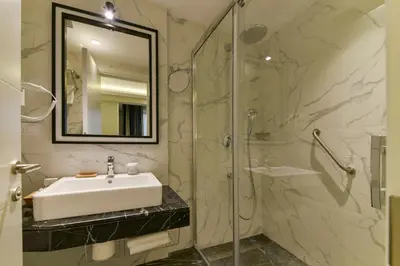 a bathroom with a sink and a shower at Kare Hotel Sultanahmet in Istanbul