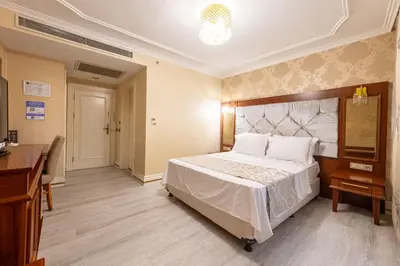 a bedroom with a large bed and a desk at Myy Boutique Hotel in Istanbul