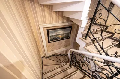 a stairway with a painting on the wall at Myy Boutique Hotel in Istanbul