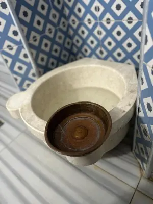 a white toilet sitting on a shelf in a room at Grand Heykel Hotel in Bursa