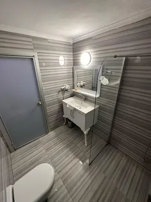 a bathroom with a sink and a toilet at Grand Heykel Hotel in Bursa