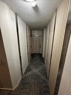 a hallway of a hotel with a long hallway sidx sidx at Grand Heykel Hotel in Bursa