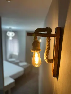 a light on a wall with a rope hanging from it at Grand Heykel Hotel in Bursa